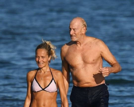 Joanna Haythorn's ex-husband, Charles Dance with his girlfriend, Alessandra Masi on the beach.
